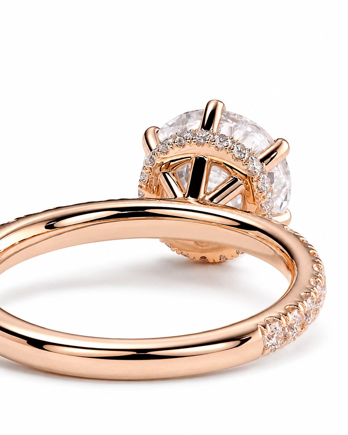 color_10K_RG, color_14K_RG &&
Rose gold ring with a large round clear center stone and a halo of small clear stones, shown on a clean white background.