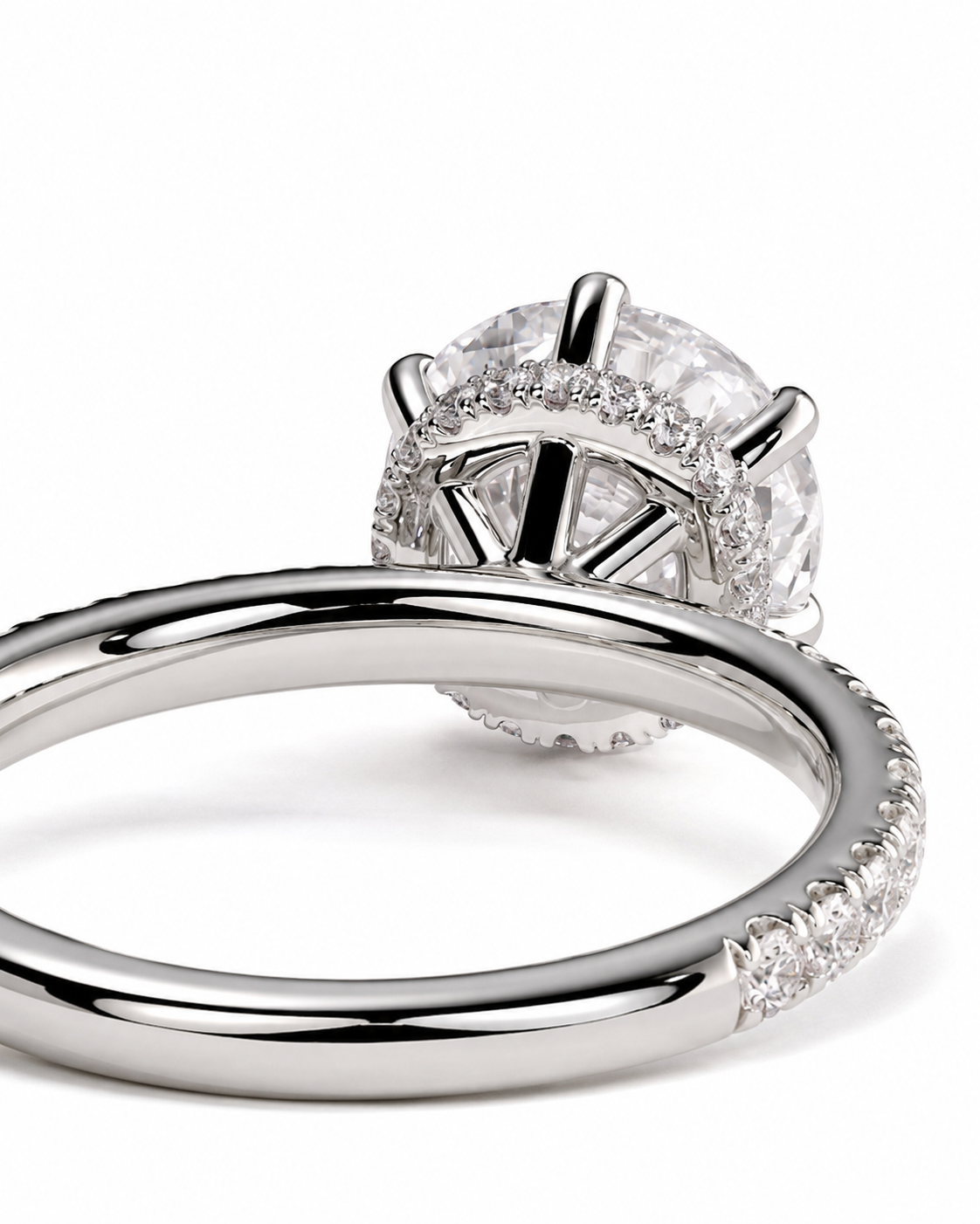 color_925_SIL,color_935_ARG,color_10K_WG, color_14K_WG &&
A close-up studio shot of a silver-toned ring with a large clear oval center stone and a halo of smaller clear stones, shown on a white background.