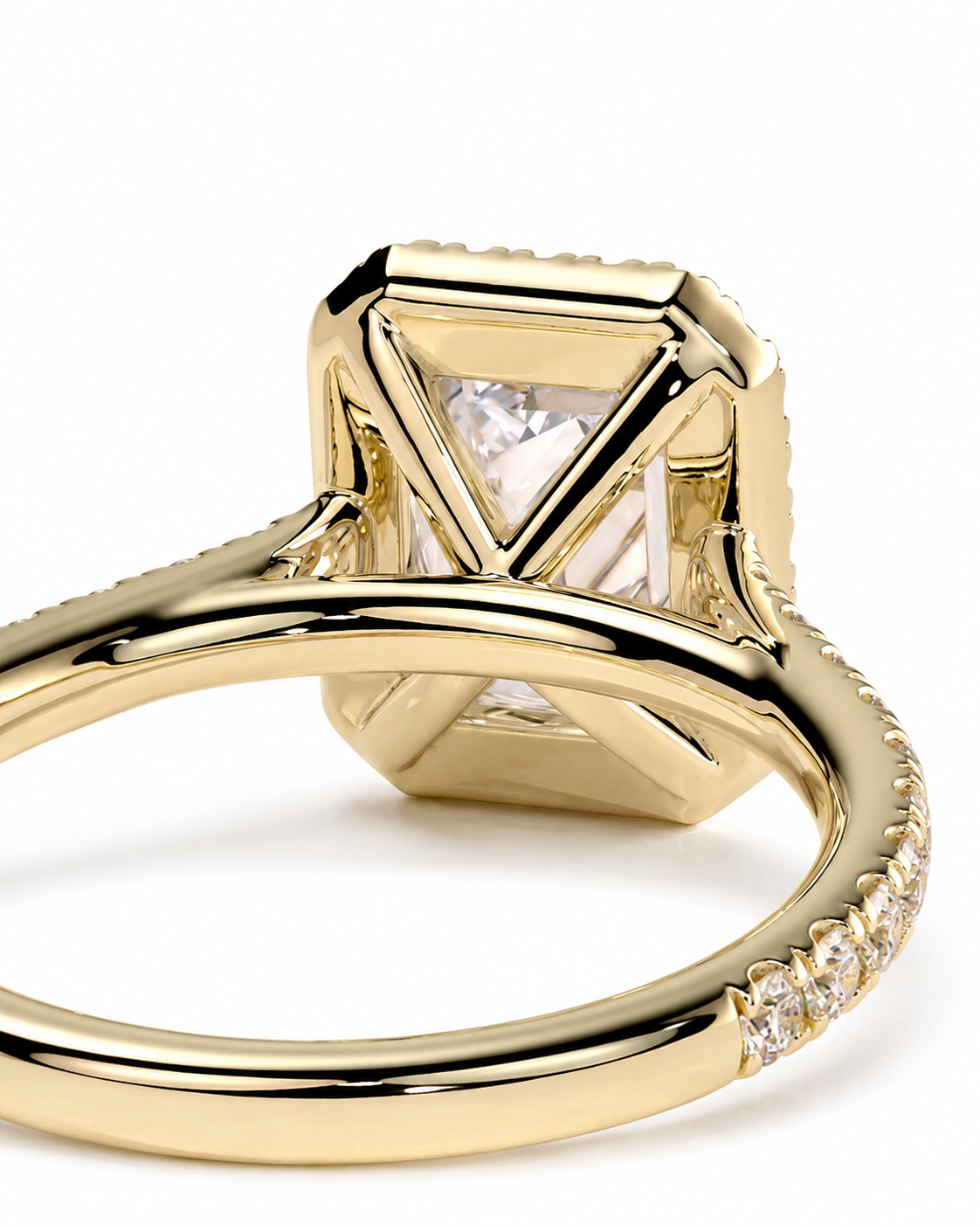 color_10K_YG, color_14K_YG &&A close-up of a yellow gold ring featuring a large square bezel-set clear gemstone with a triangular center, accented by small pavé diamonds along the shank, on a white background.