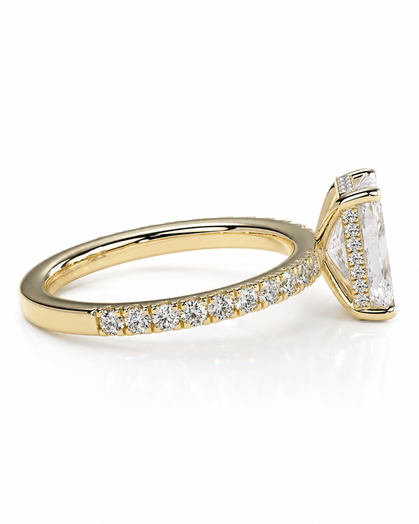 color_10K_YG, color_14K_YG &&A yellow gold ring featuring a large rectangular clear gemstone in a prong setting, with a pavé band set with smaller round diamonds, shown on a white background.