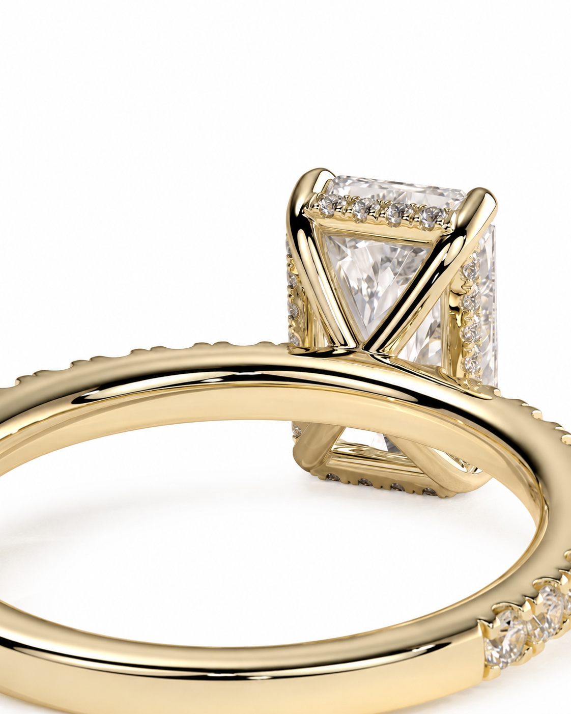 color_10K_YG, color_14K_YG &&A close-up of a yellow gold ring featuring a rectangular clear gemstone in a geometric prong setting, with small pavé accents along the band, shown on a white background.