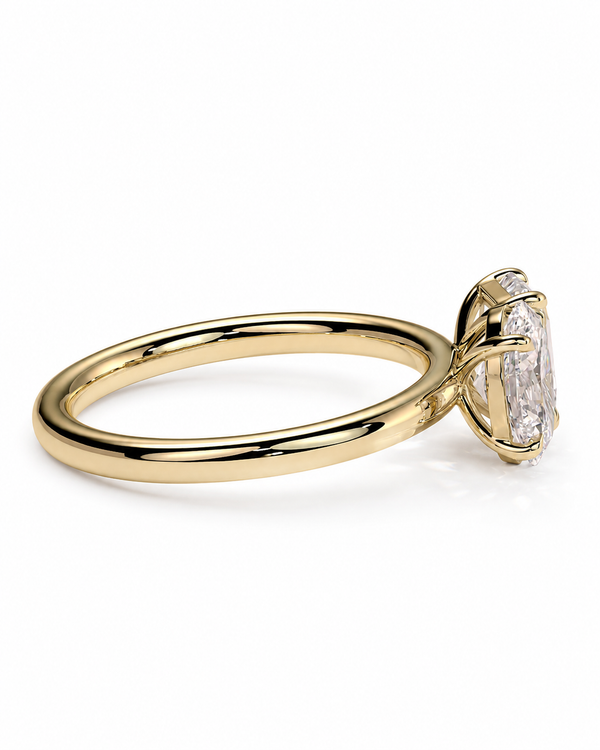 color_10K_YG, color_14K_YG &&A yellow gold ring with a brilliant round-cut clear gemstone in a prong setting, shown on a clean white background.