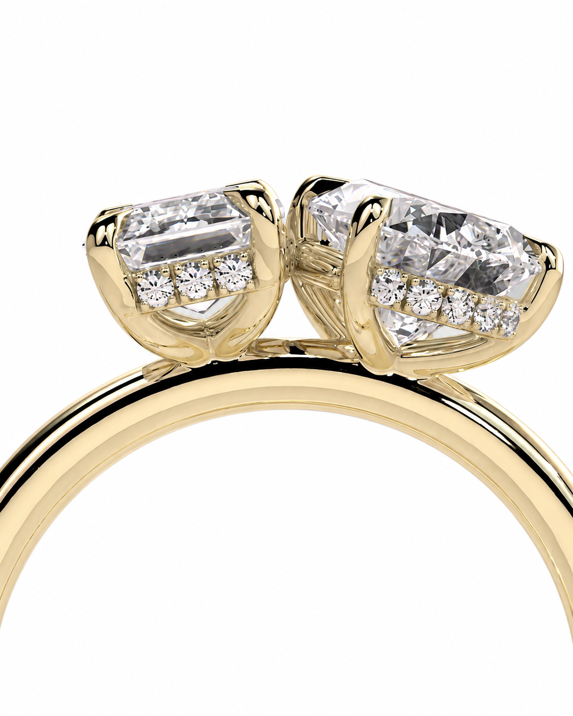 color_10K_YG, color_14K_YG &&A close-up of a yellow gold ring featuring two marquise-cut clear gemstones in a double-prong setting, with small round diamonds along the sides of the stones, shown against a plain white background.