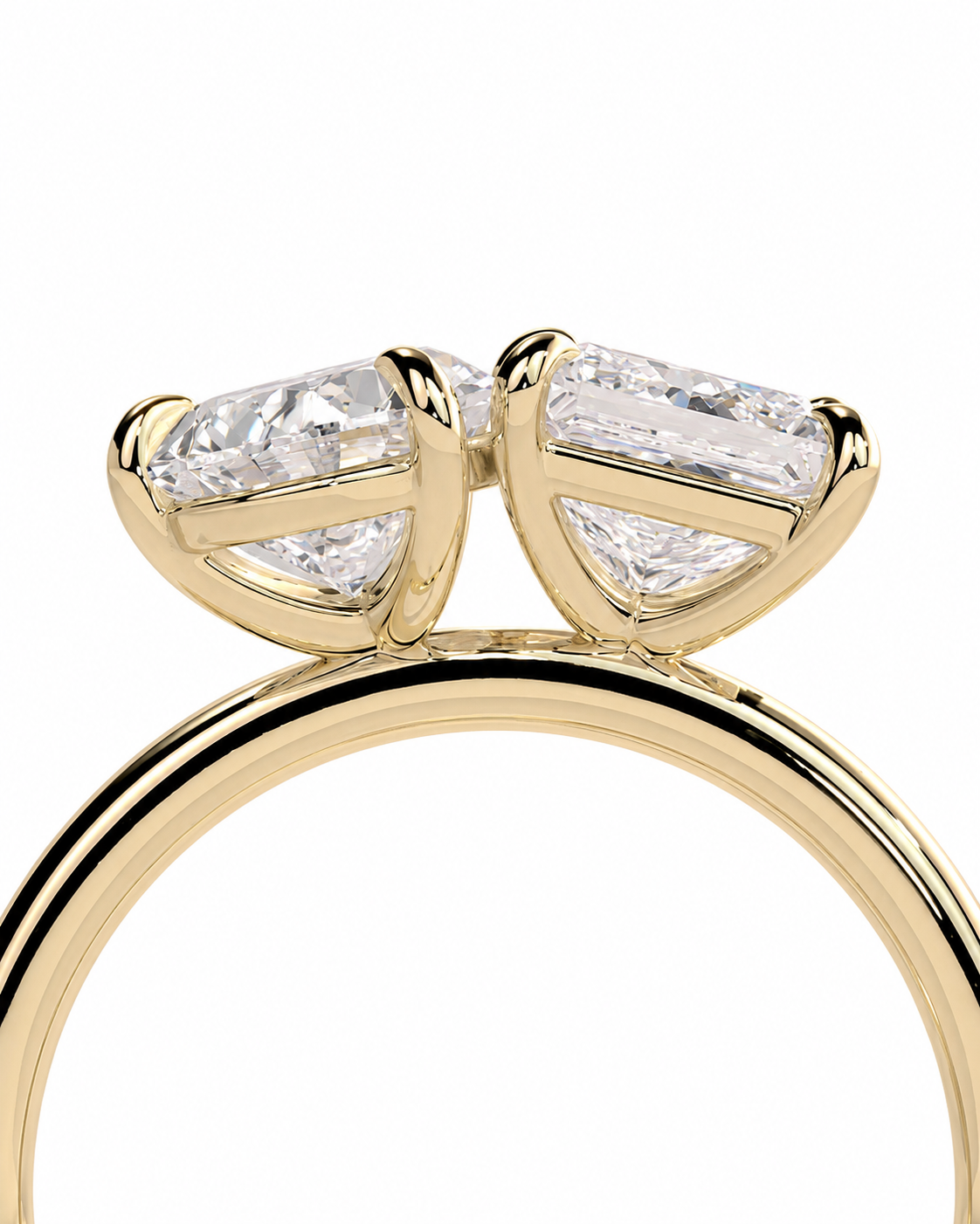 color_10K_YG, color_14K_YG &&A close-up of a yellow gold ring featuring a unique double-prong setting with two marquise-cut diamonds on each prong, set against a plain white background.