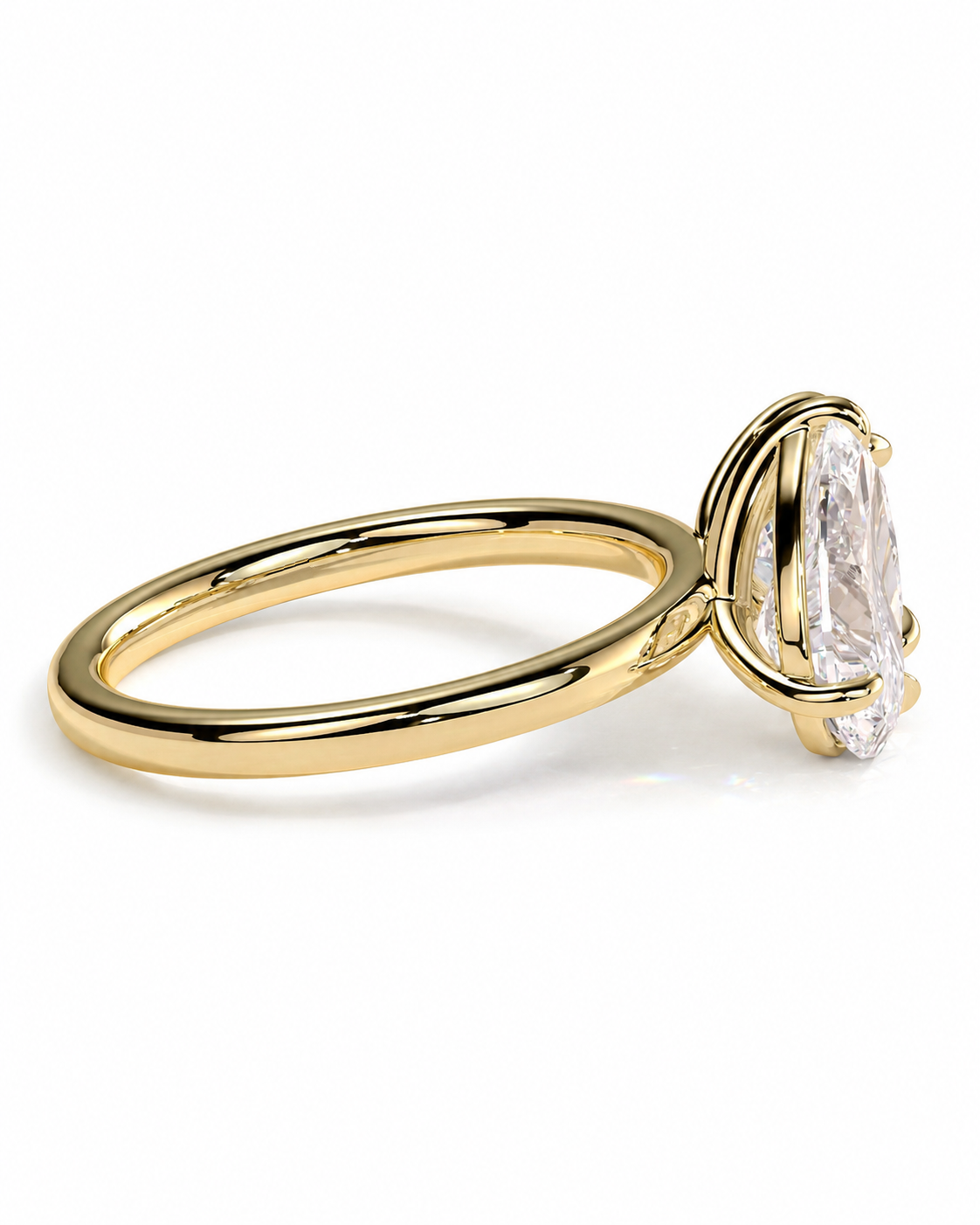 color_10K_YG, color_14K_YG &&A yellow gold solitaire ring featuring a marquise-cut clear gemstone in a prong setting, shown on a clean white background.