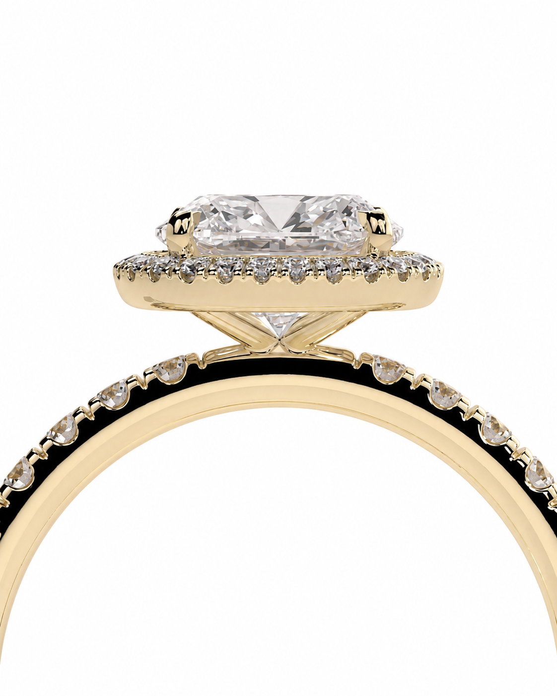 color_10K_YG, color_14K_YG &&A close-up of a yellow gold ring featuring a cushion-cut clear center stone surrounded by a halo of small clear stones, with a matching stone set on the band, shown against a plain white background.