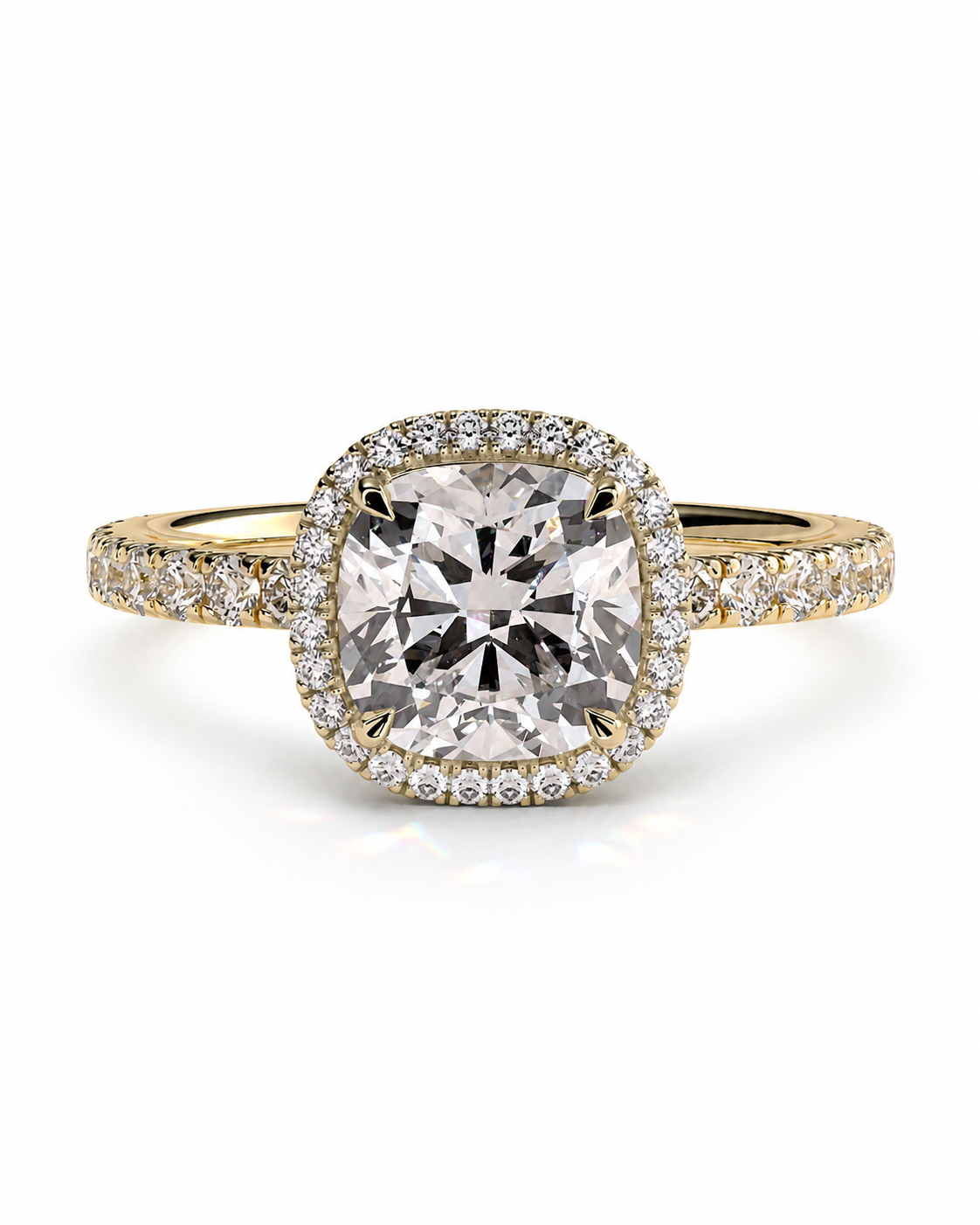 color_10K_YG, color_14K_YG &&A yellow gold halo ring featuring a large cushion-cut center stone surrounded by a halo of small clear stones, with additional pavé stones along the shoulders, set against a plain white background.