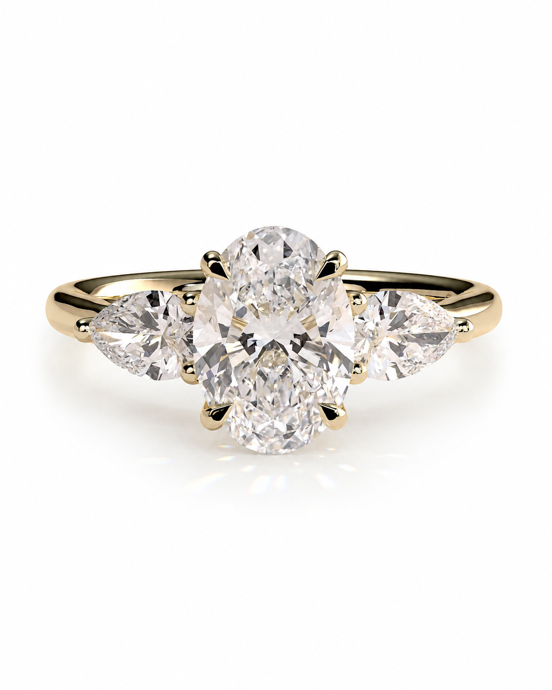 color_10K_YG, color_14K_YG &&
A yellow gold three-stone diamond ring with a large oval center diamond and two marquise-cut side diamonds, shown on a clean white background.