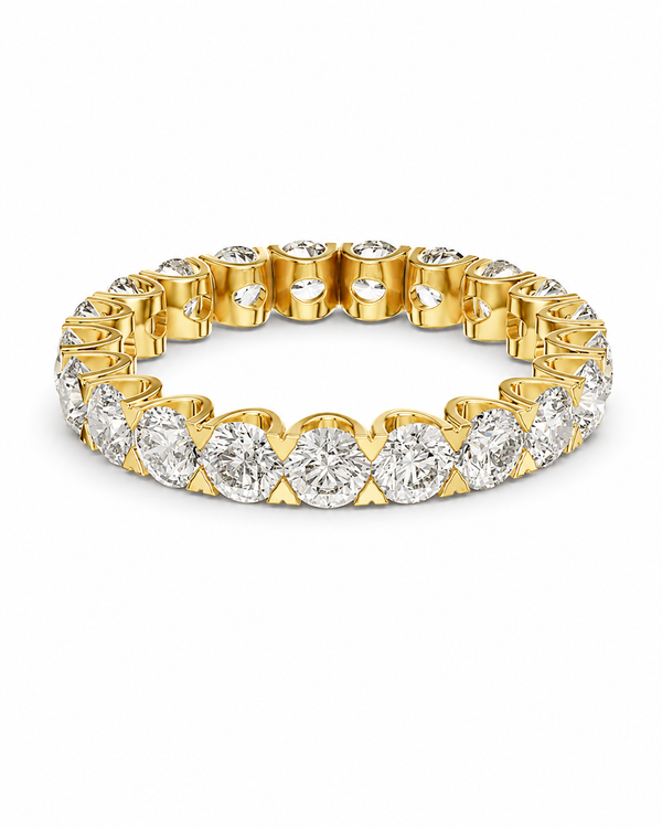 color_10K_YG, color_14K_YG &&	
A yellow gold eternity band featuring a continuous row of round brilliant-cut diamonds in a prong setting, shown on a clean white background.