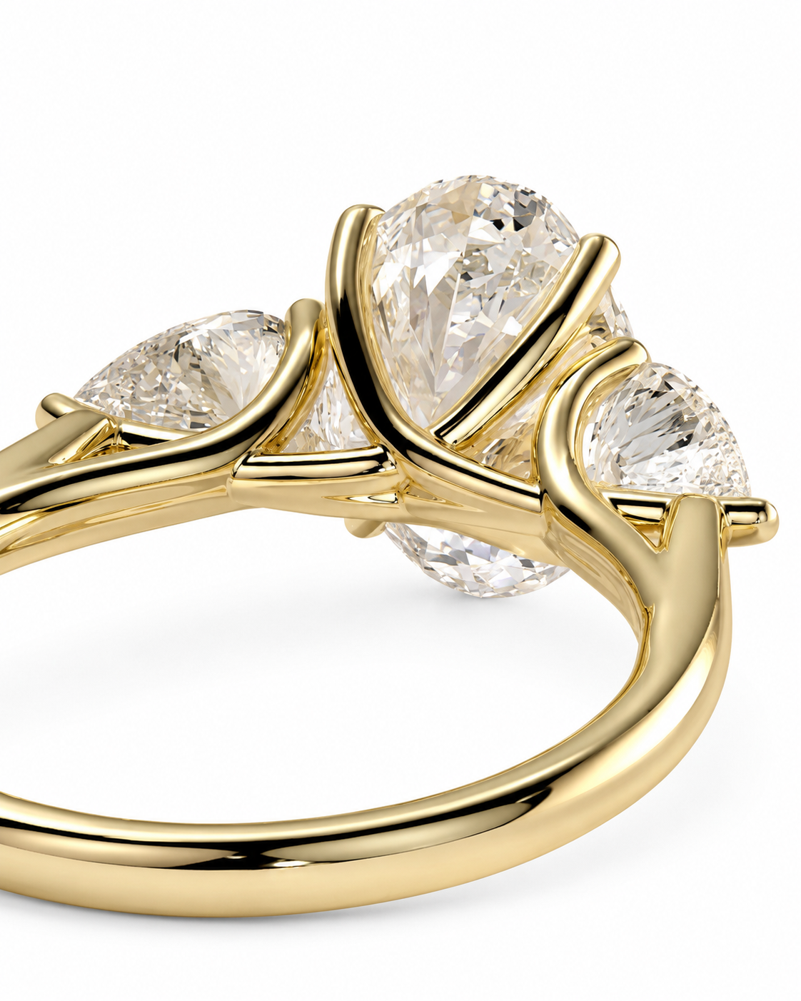 color_10K_YG, color_14K_YG &&
A close-up of a yellow gold ring featuring three clear gemstones in a curved cluster setting, photographed on a clean white background.