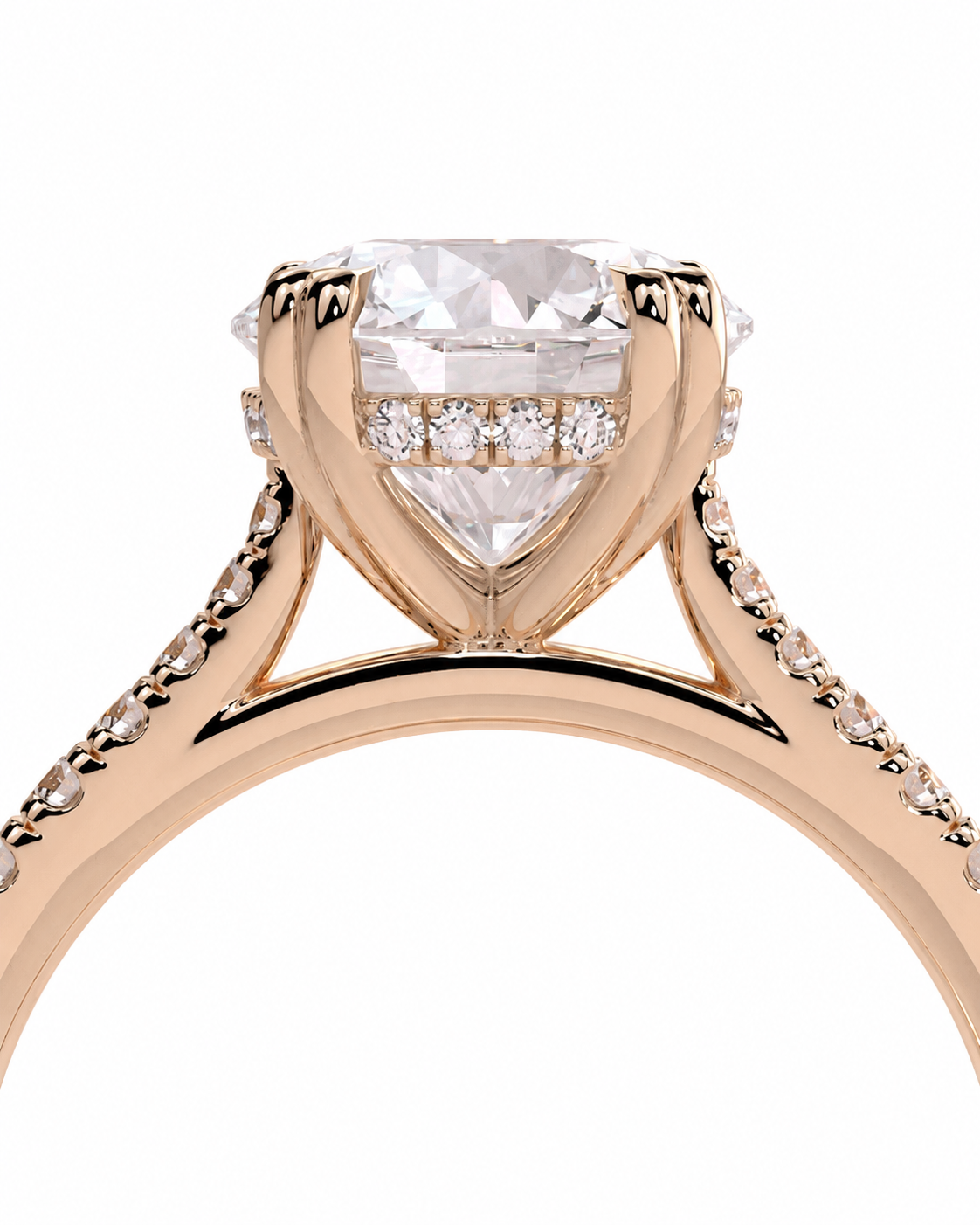 color_10K_RG, color_14K_RG &&
A close-up studio shot of a rose gold engagement ring featuring a large heart-shaped clear gemstone in a prong setting, accented by smaller diamonds along the band and under the main stone, on a solid white background.