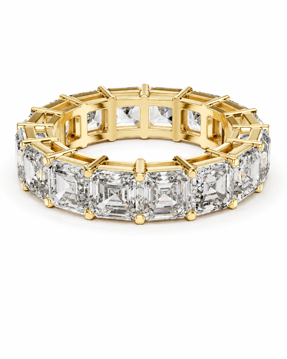 color_10K_YG, color_14K_YG &&	
A yellow gold eternity ring featuring a continuous row of emerald-cut clear diamonds in a prong setting, shown on a clean white background.