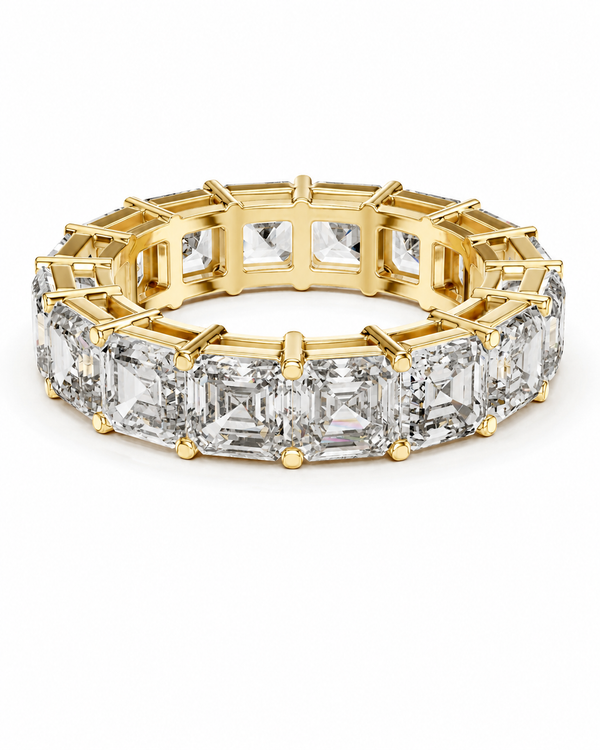 color_10K_YG, color_14K_YG &&	
A yellow gold eternity ring featuring a continuous row of emerald-cut clear diamonds in a prong setting, shown on a clean white background.