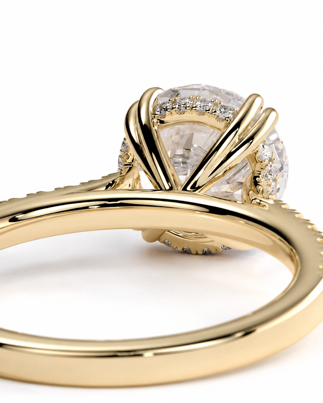 color_10K_YG, color_14K_YG &&
A close-up shot of a yellow gold ring featuring a large round clear gemstone in a prong setting with smaller accent stones along the halo, on a white background.