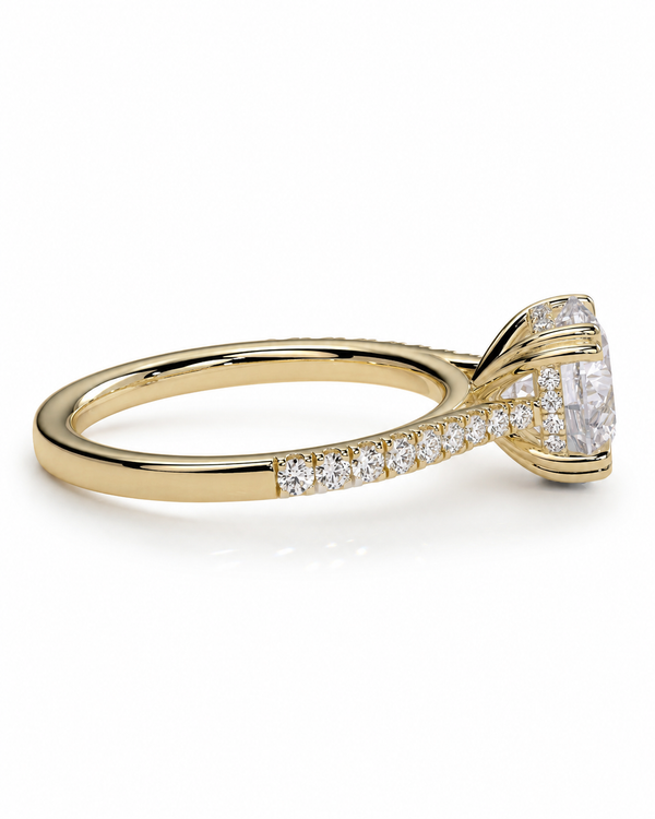 color_10K_YG, color_14K_YG &&
A yellow gold diamond ring with a large oval center stone and a pave band set with small round diamonds, shown on a clean white background.
