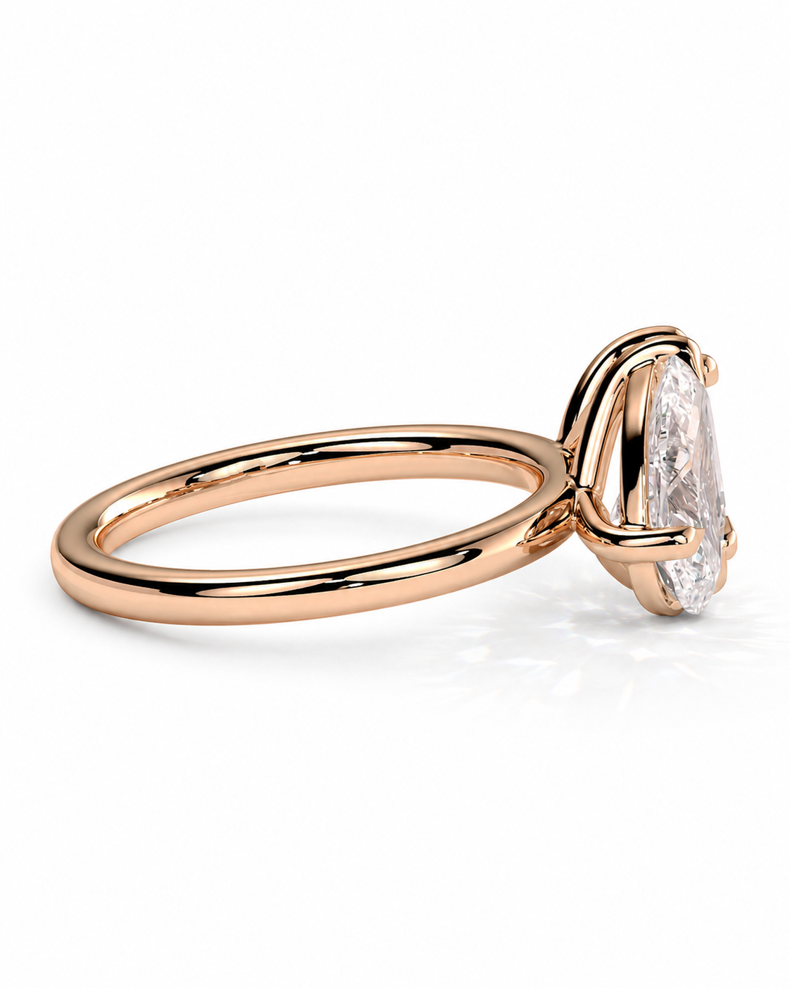 color_10K_RG, color_14K_RG &&
A rose gold solitaire ring featuring a marquise-cut clear gemstone in a four-prong setting, shown on a clean white background.