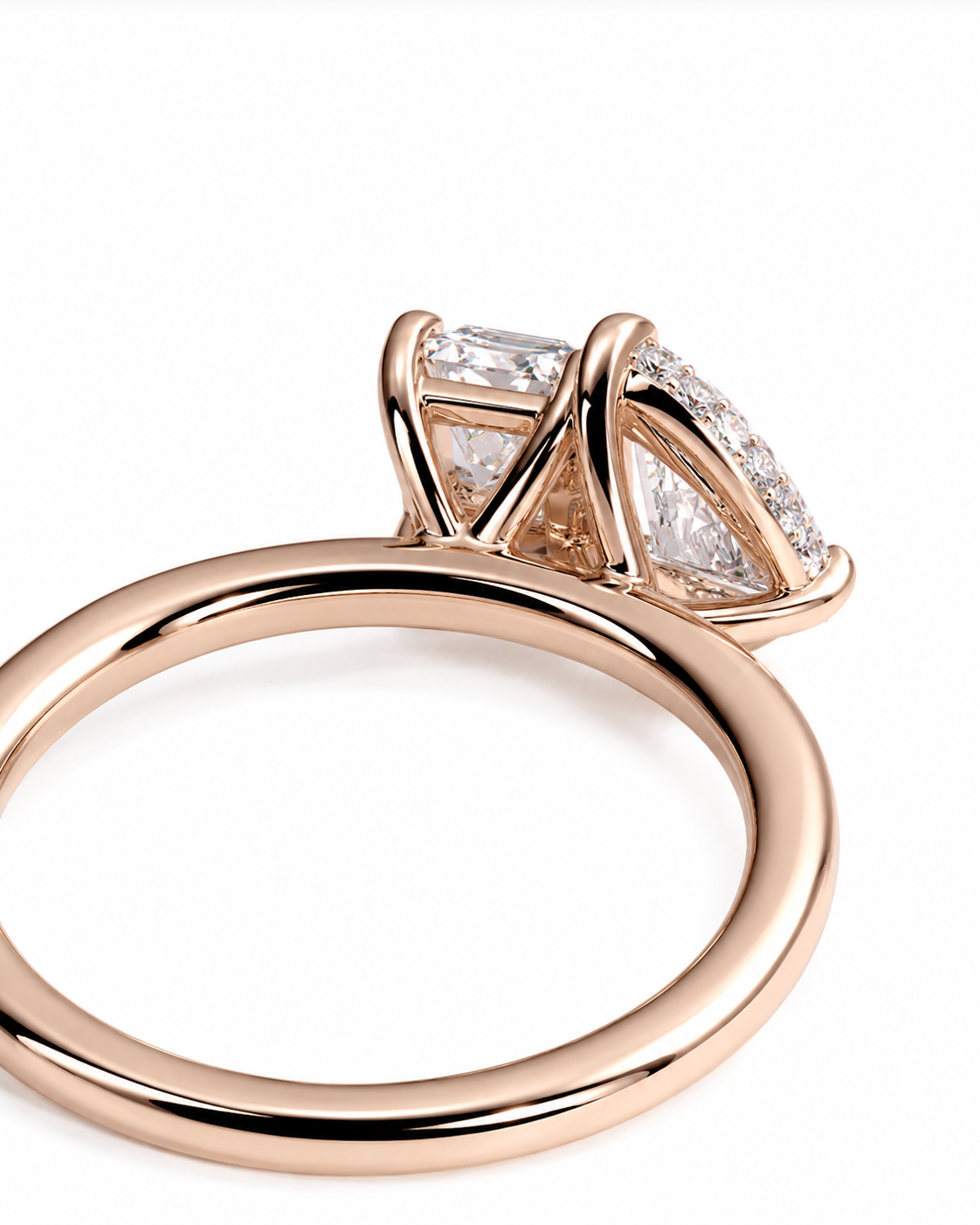 color_10K_RG, color_14K_RG &&
Rose gold ring with a marquise-cut center stone and smaller round stones in a prong setting, shown on a clean white background.