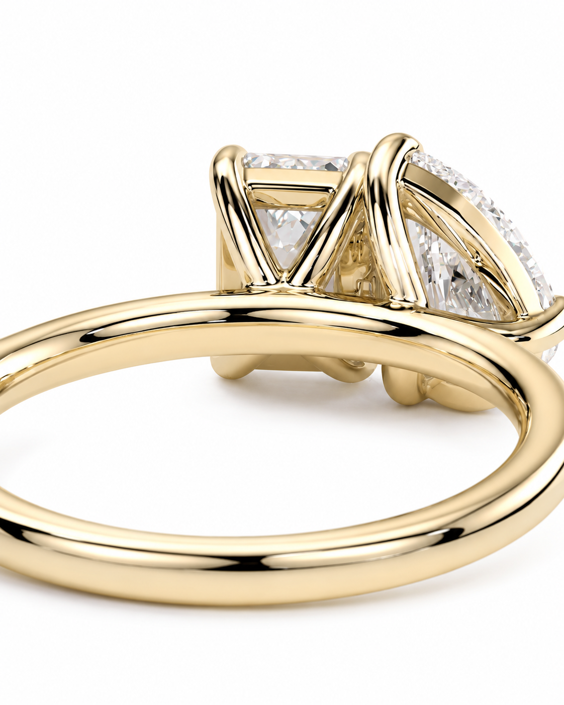 color_10K_YG, color_14K_YG &&
A close-up shot of a yellow gold ring with a triangular diamond cluster setting on a white background.