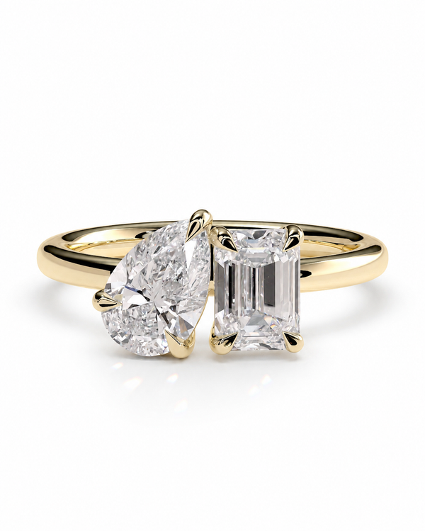 color_10K_YG, color_14K_YG &&
A yellow gold ring set featuring a heart-shaped diamond and an emerald-cut diamond, shown on a clean white background.