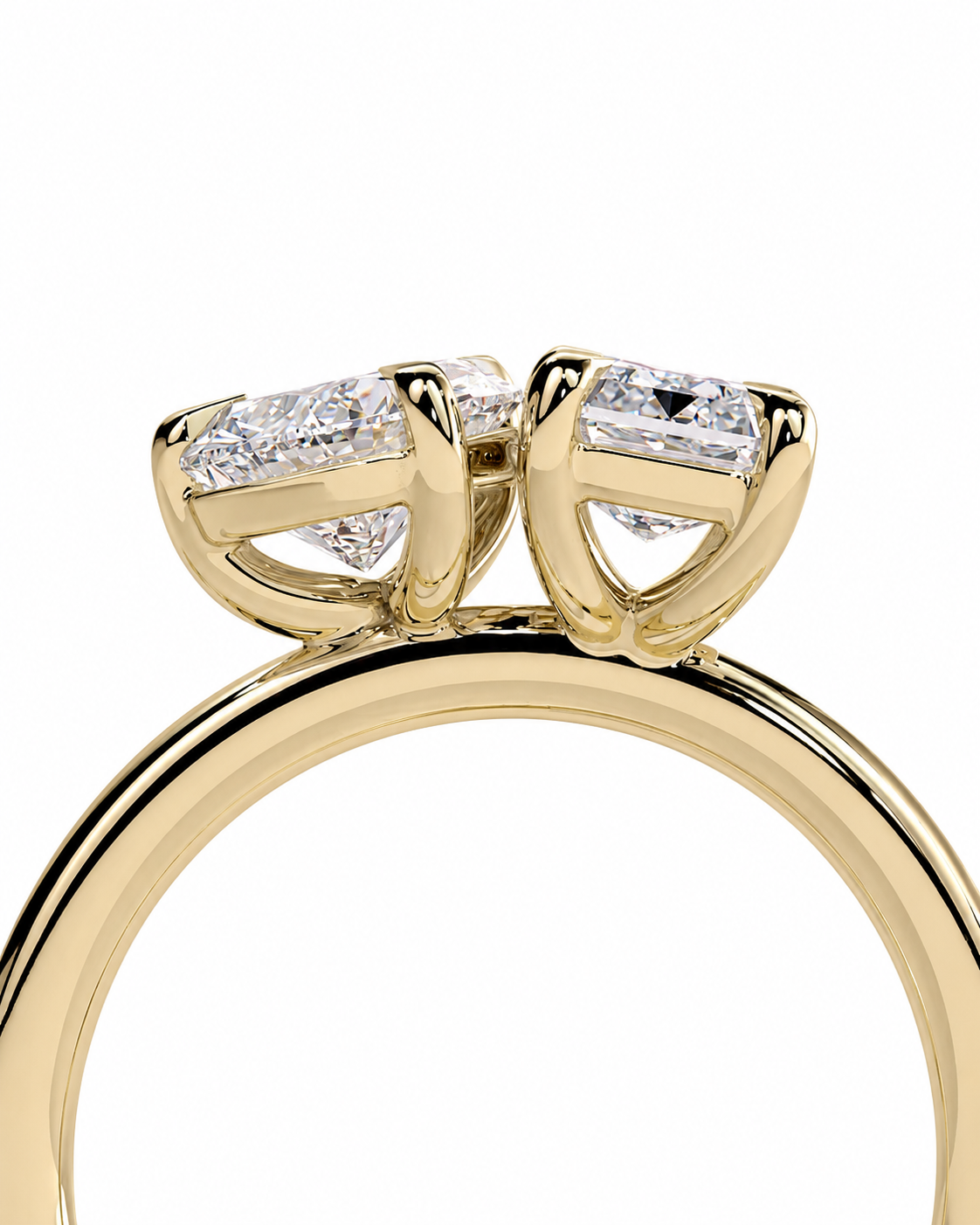 color_10K_YG, color_14K_YG &&
A close-up of a yellow gold ring featuring a double-prong setting with baguette-cut clear gemstones, shown against a plain white background.