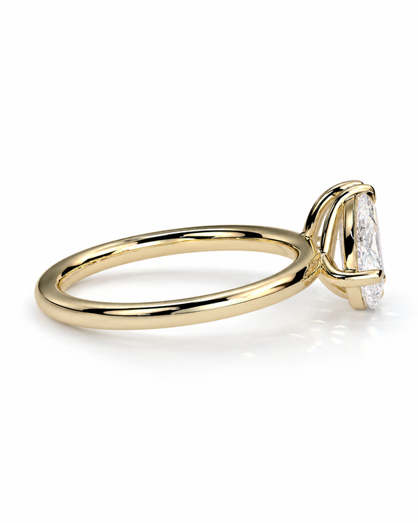 color_10K_YG, color_14K_YG &&
A yellow gold ring with a single pear-cut diamond in a prong setting, shown on a clean white background.