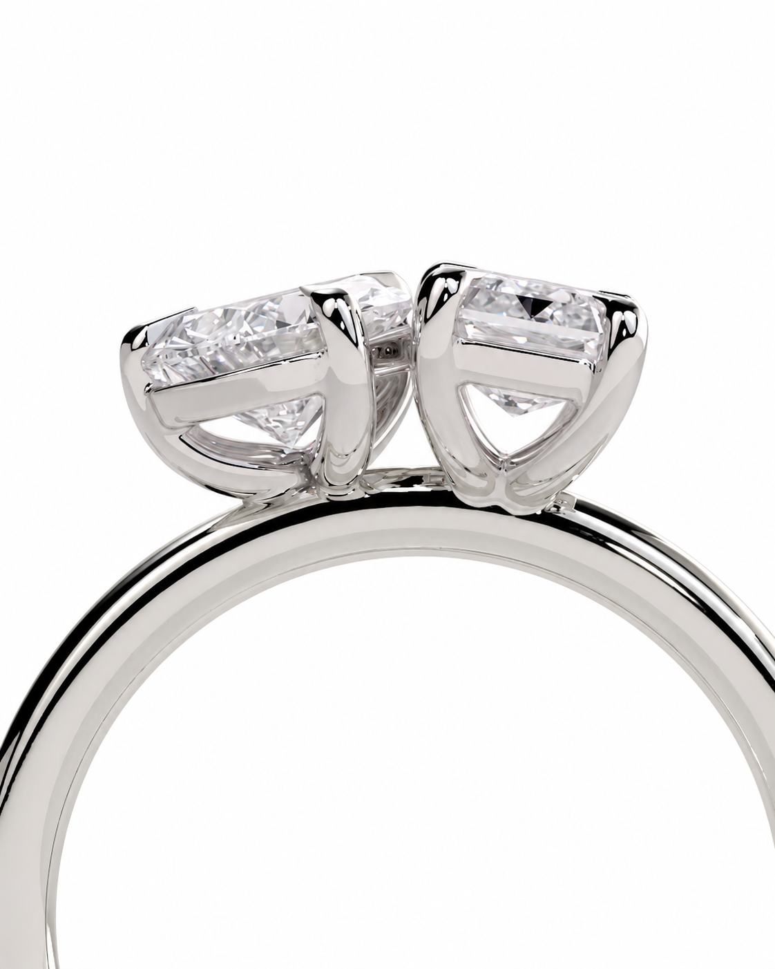 color_925_SIL,color_935_ARG,color_10K_WG, color_14K_WG &&
A close-up of a silver-toned ring featuring two triangular cluster settings with clear gemstones, shown against a plain white background.