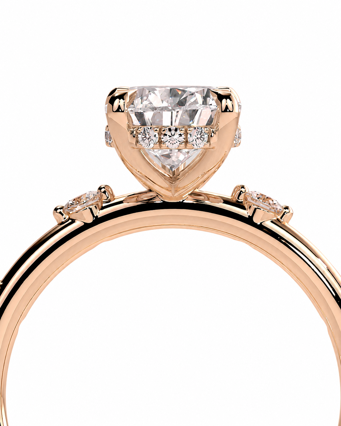 color_10K_RG, color_14K_RG &&
A close-up of a rose gold engagement ring featuring a large heart-shaped clear gemstone in a three-stone setting, with smaller round diamonds along the band, on a white background.