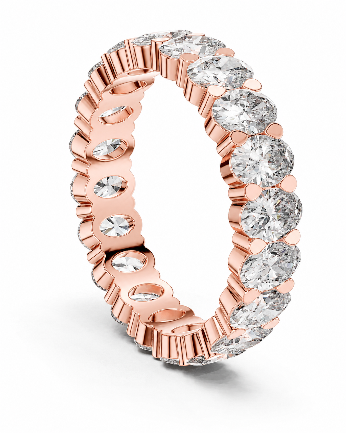 color_10K_RG, color_14K_RG &&	A rose gold eternity ring featuring a continuous row of round brilliant-cut clear gemstones in a prong setting, shown on a clean white background.