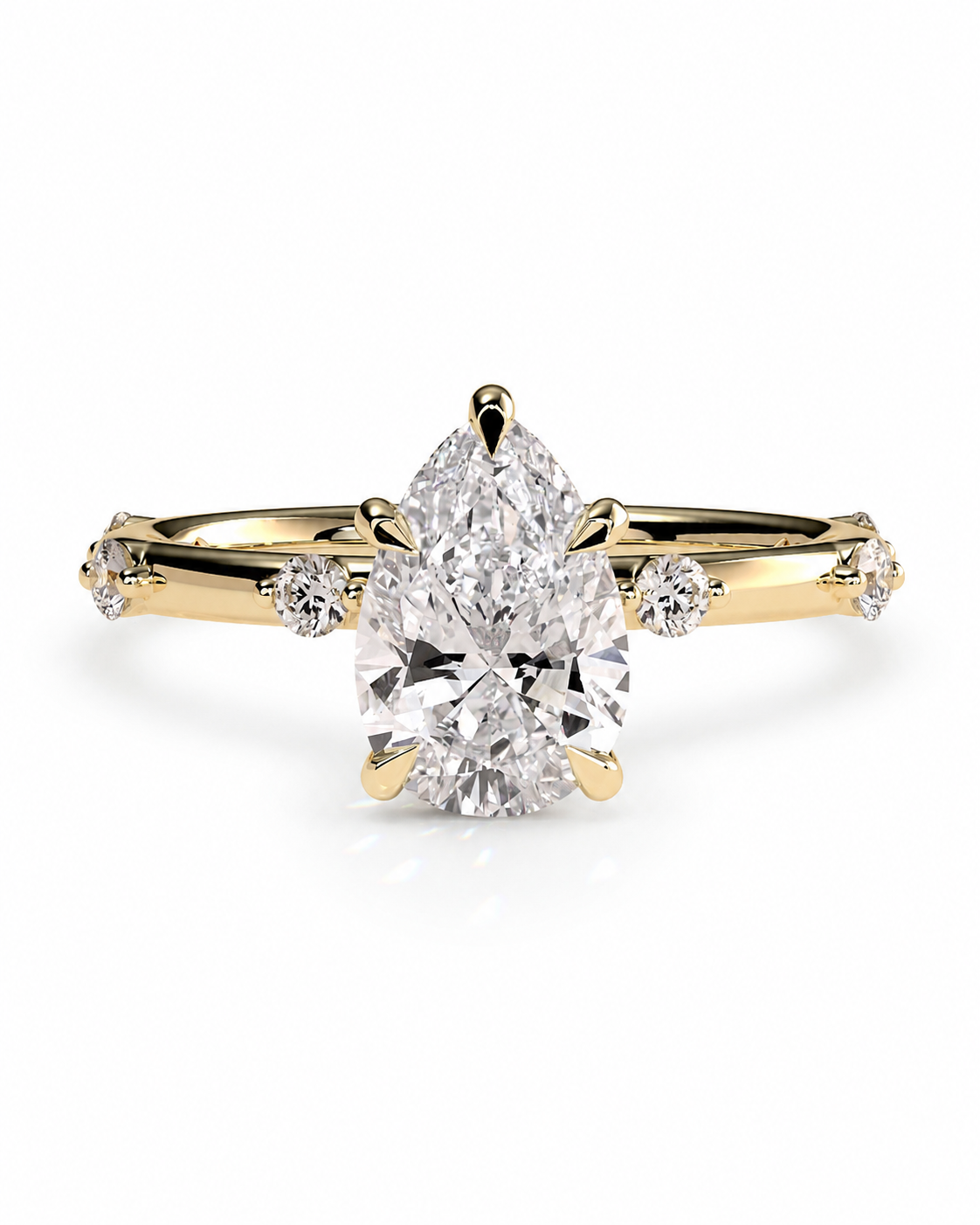 color_10K_YG, color_14K_YG &&
A yellow gold ring featuring a large pear-cut center diamond and smaller round diamonds on the shoulders, set against a clean white background.