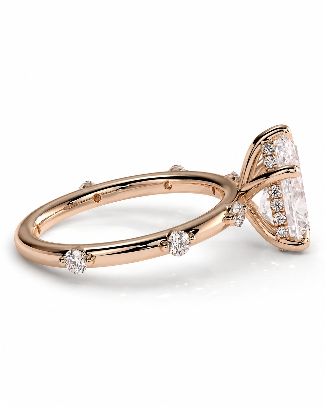 color_10K_RG, color_14K_RG &&
A rose gold engagement ring featuring a large oval-cut clear center stone and smaller accent diamonds along the shank, shown on a clean white background.