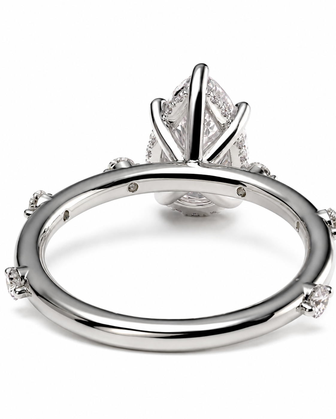 color_925_SIL,color_935_ARG,color_10K_WG, color_14K_WG &&
A close-up studio shot of a silver-toned ring from the back, showing a polished band with small side stones and a large central gemstone in a prong setting on a white background.
