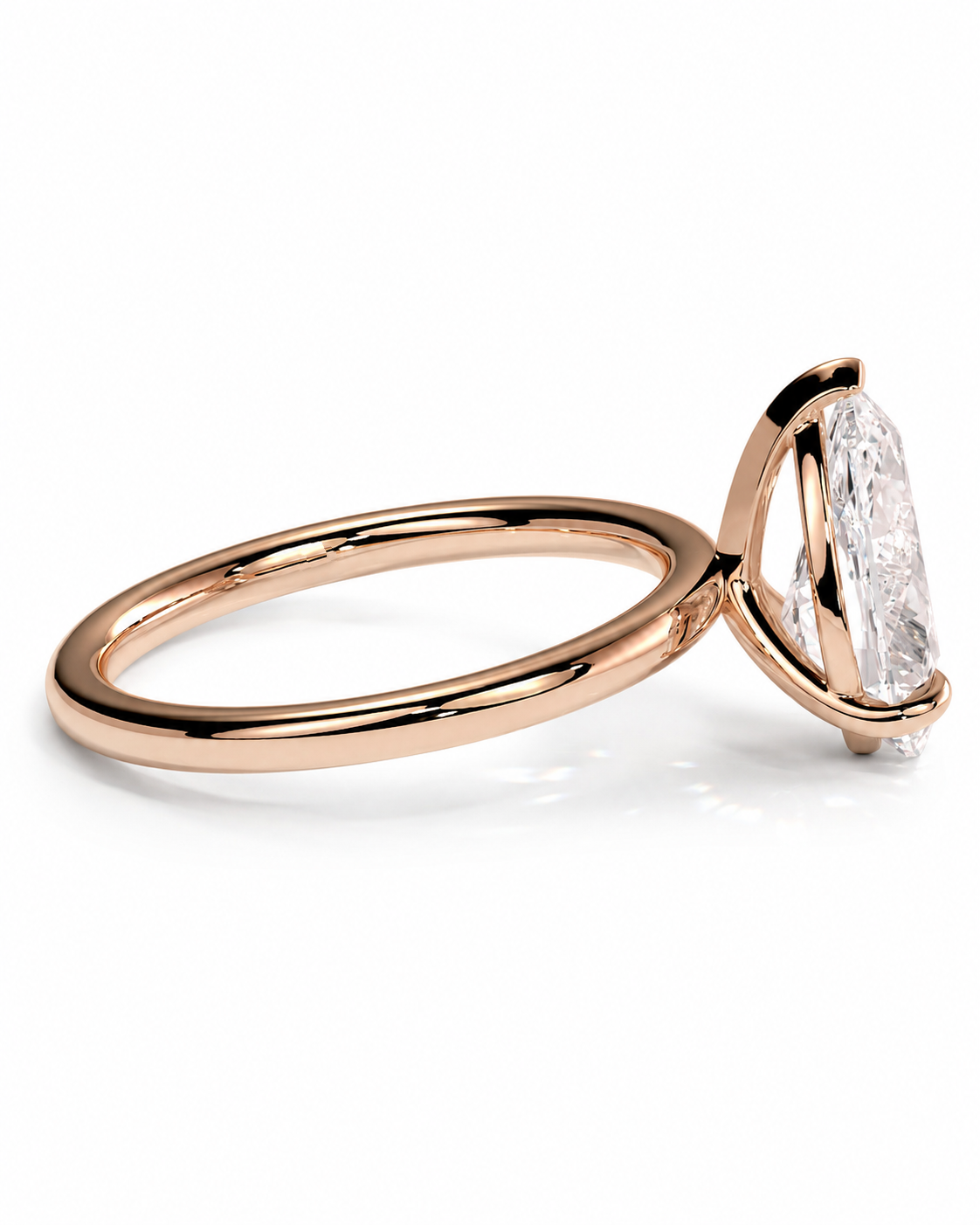 color_10K_RG, color_14K_RG &&
A rose gold solitaire engagement ring featuring a marquise-cut clear gemstone in a prong setting, shown on a clean white background.