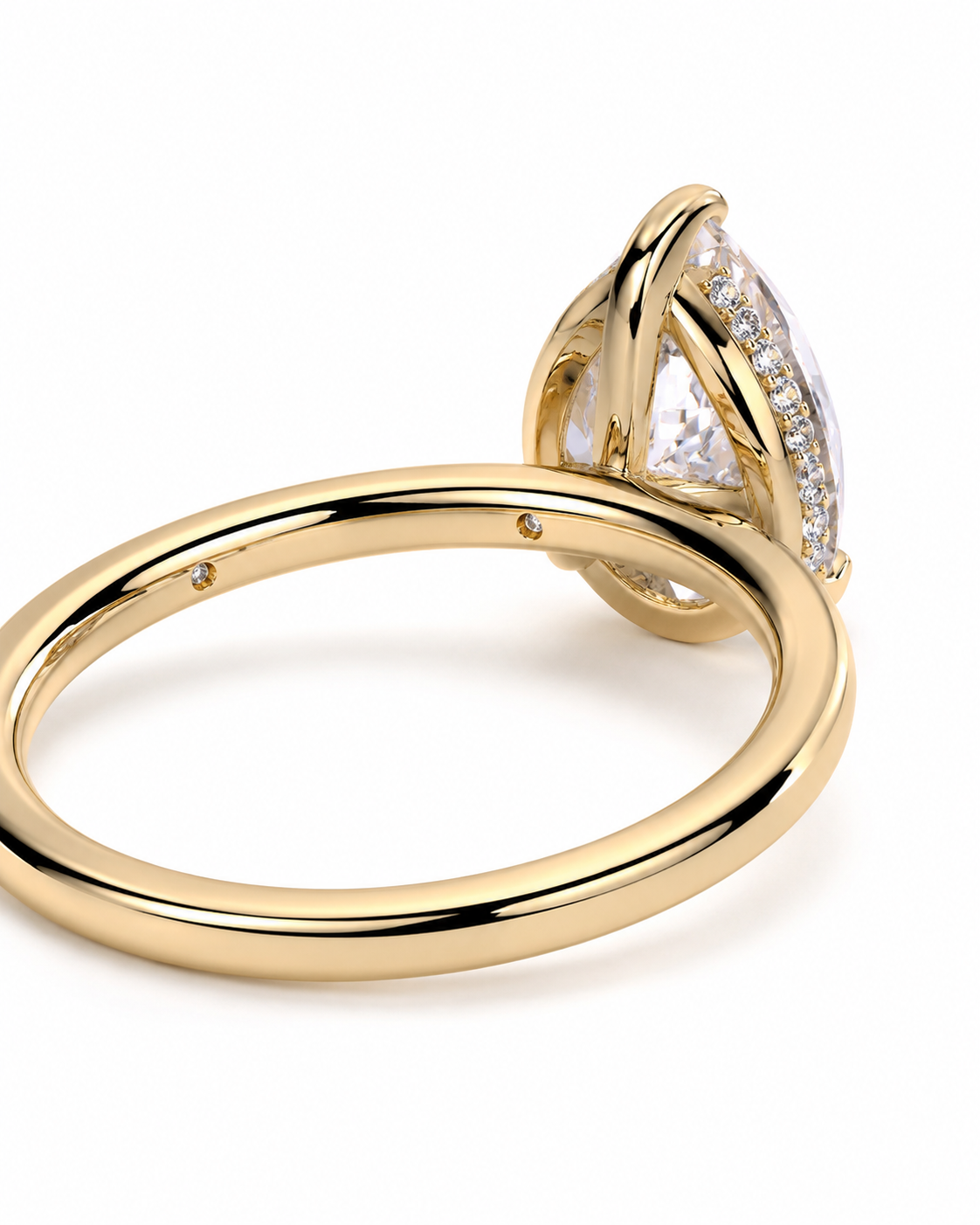 color_10K_YG, color_14K_YG &&
A close-up shot of a yellow gold ring with a marquise-cut clear gemstone and small accent diamonds, shown on a clean white background.