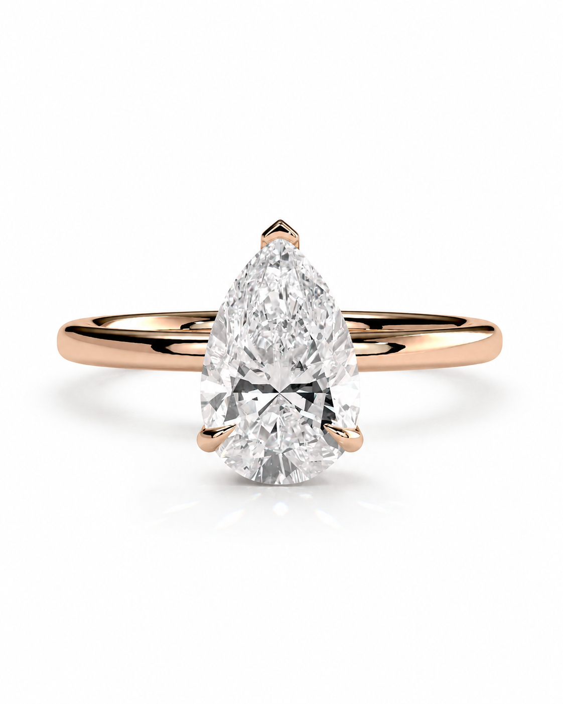 color_10K_RG, color_14K_RG &&
A pear-cut diamond solitaire engagement ring set in a rose gold band, shown on a clean white background with a soft reflection.