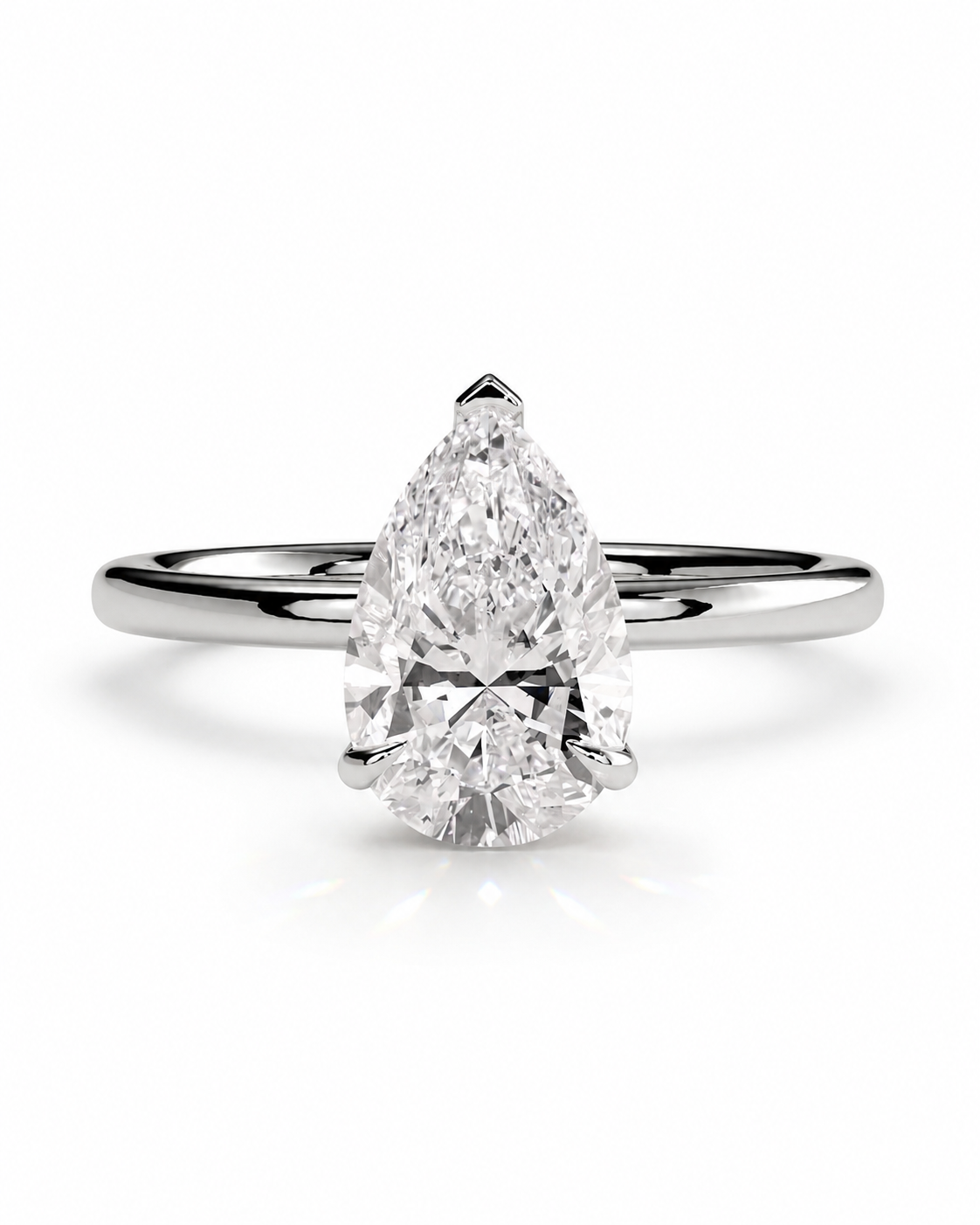 color_925_SIL,color_935_ARG,color_10K_WG, color_14K_WG &&
A pear-cut diamond engagement ring with a brilliant solitaire setting on a polished silver-colored band, shown against a clean white background.
