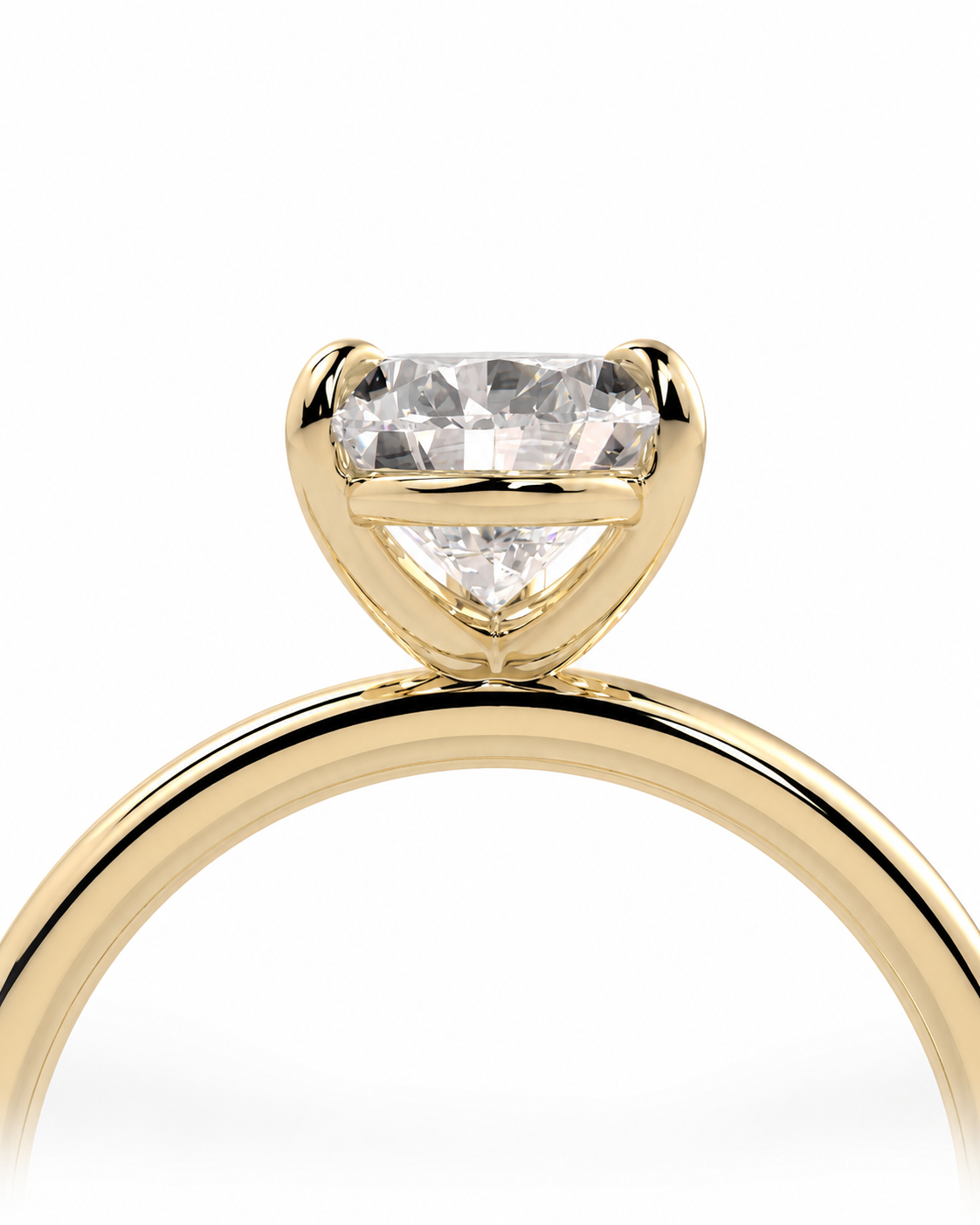 color_10K_YG, color_14K_YG &&
A close-up of a yellow gold solitaire engagement ring featuring a heart-shaped clear gemstone in a prong setting, shown against a solid white background.