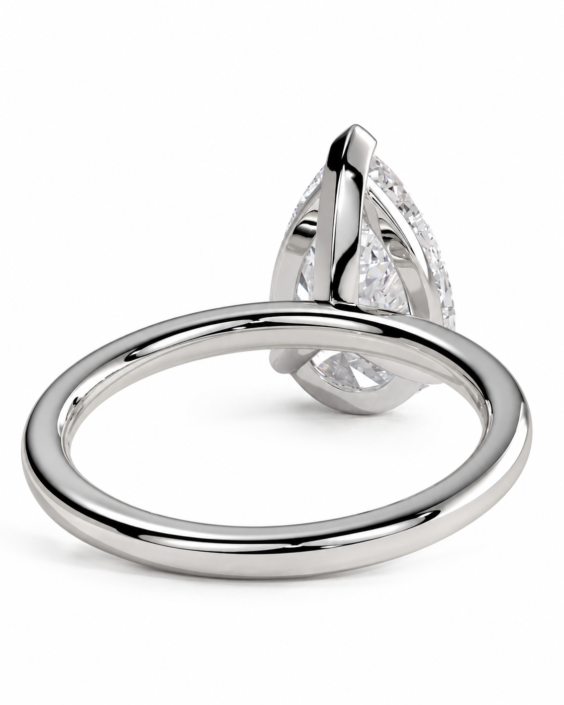color_925_SIL,color_935_ARG,color_10K_WG, color_14K_WG &&
A close-up studio shot of a silver-toned ring with a teardrop-shaped clear gemstone in a prong setting, shown against a plain white background.