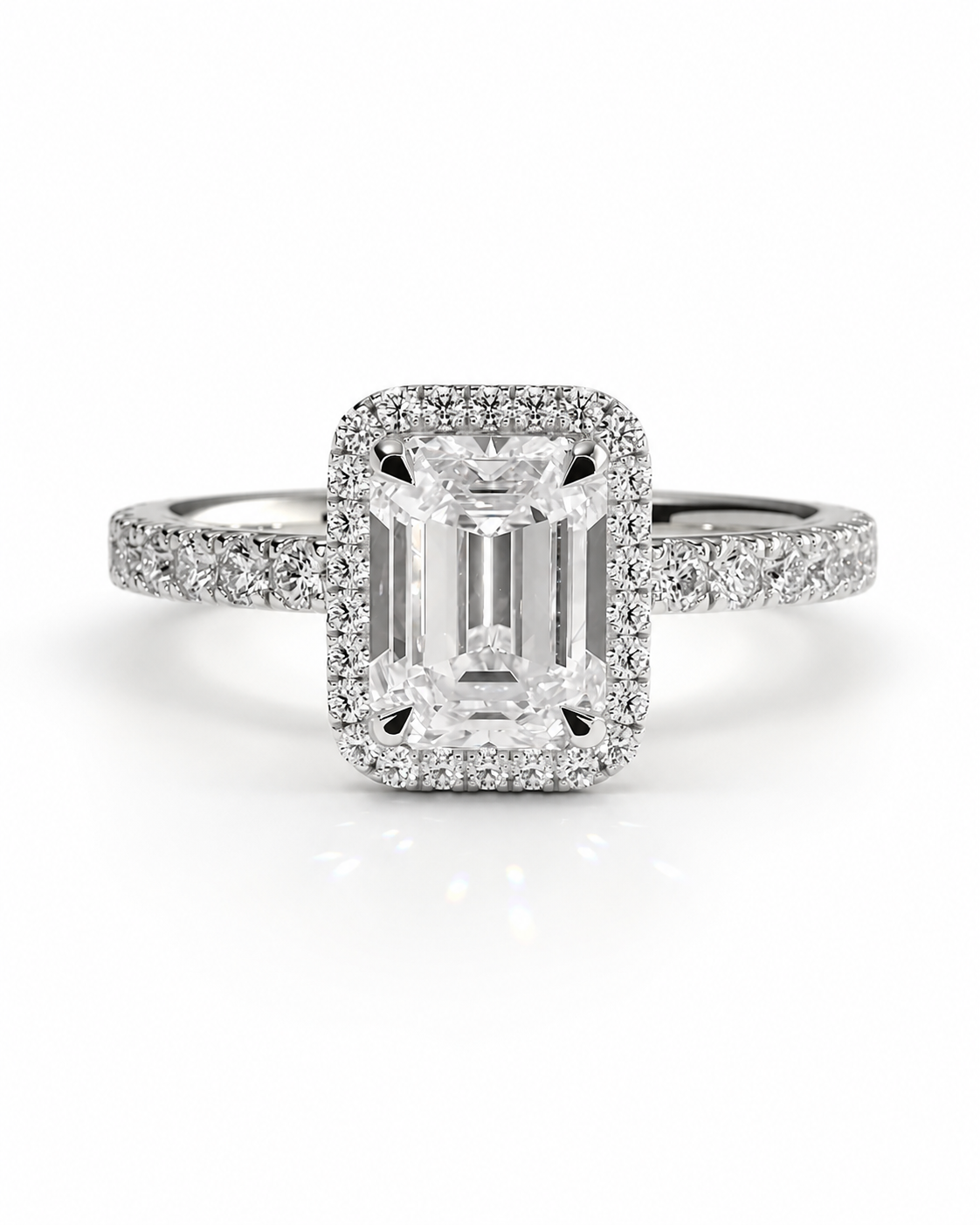 color_925_SIL,color_935_ARG,color_10K_WG, color_14K_WG &&An emerald-cut diamond engagement ring with a double halo setting and a pave band, shown on a clean white background.