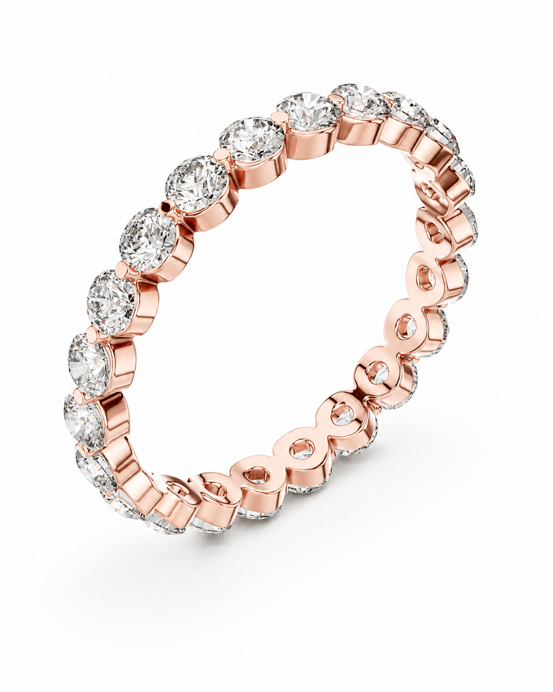 color_10K_RG, color_14K_RG &&	A rose gold eternity ring featuring a continuous row of round-cut clear gemstones in a prong setting, shown on a clean white background.