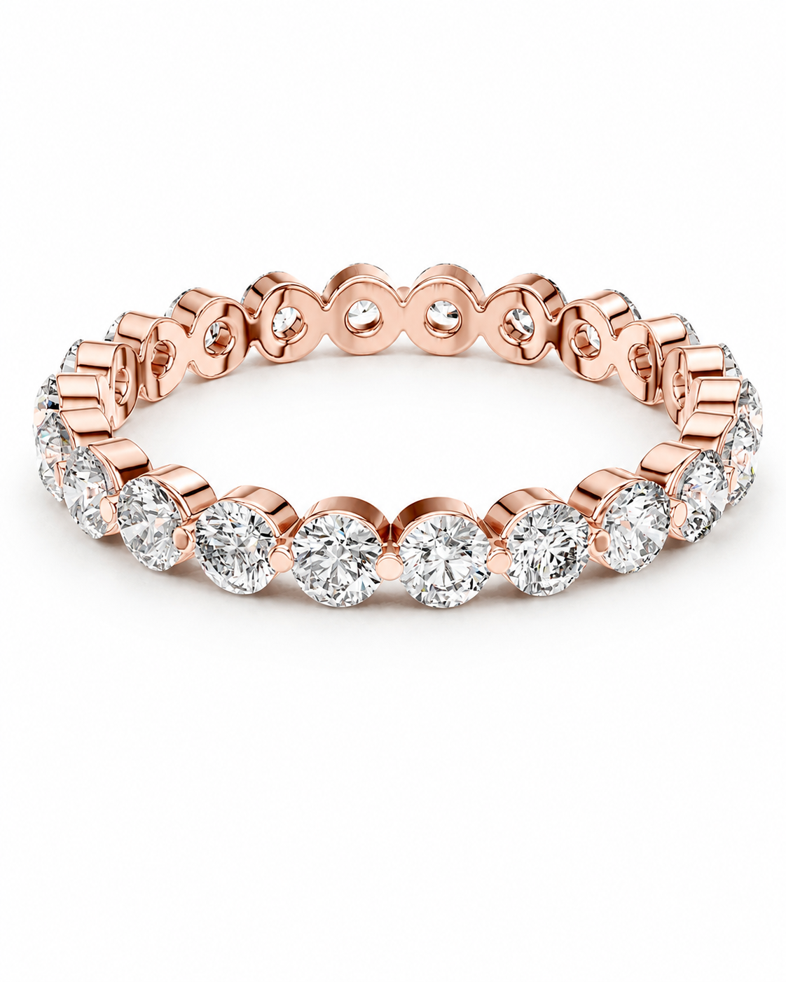 color_10K_RG, color_14K_RG &&	A rose gold eternity ring featuring a continuous row of round brilliant-cut diamonds in a prong setting, shown on a clean white background.