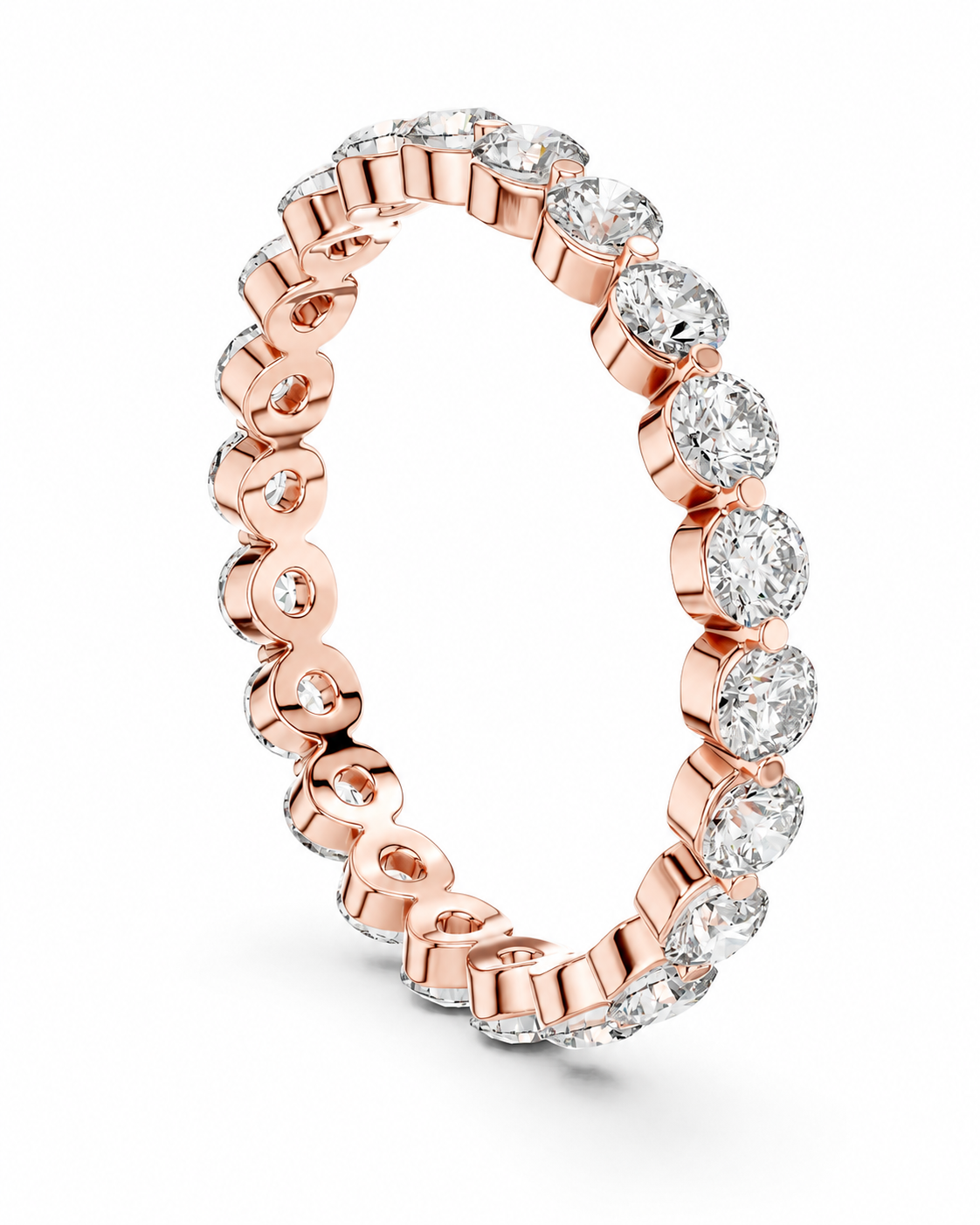color_10K_RG, color_14K_RG &&	A rose gold eternity ring featuring a continuous row of round-cut clear diamonds in a prong setting, shown on a clean white background.