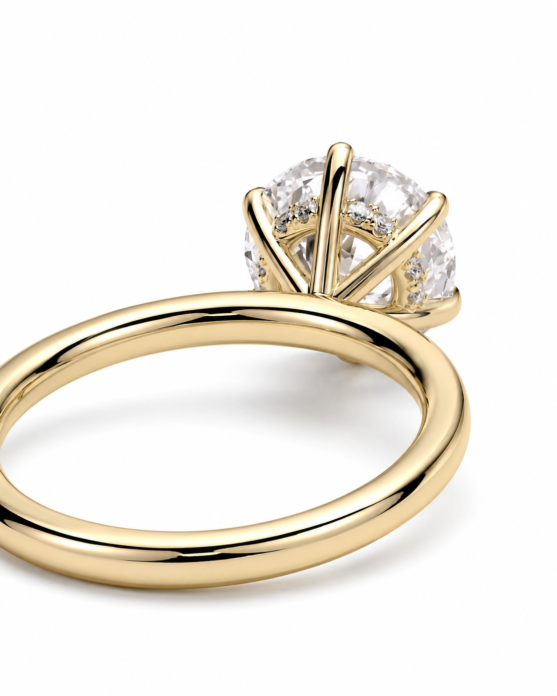 color_10K_YG, color_14K_YG &&A close-up shot of a yellow gold ring with a large round brilliant-cut diamond set in a modern, geometric prong setting, shown on a clean white background.