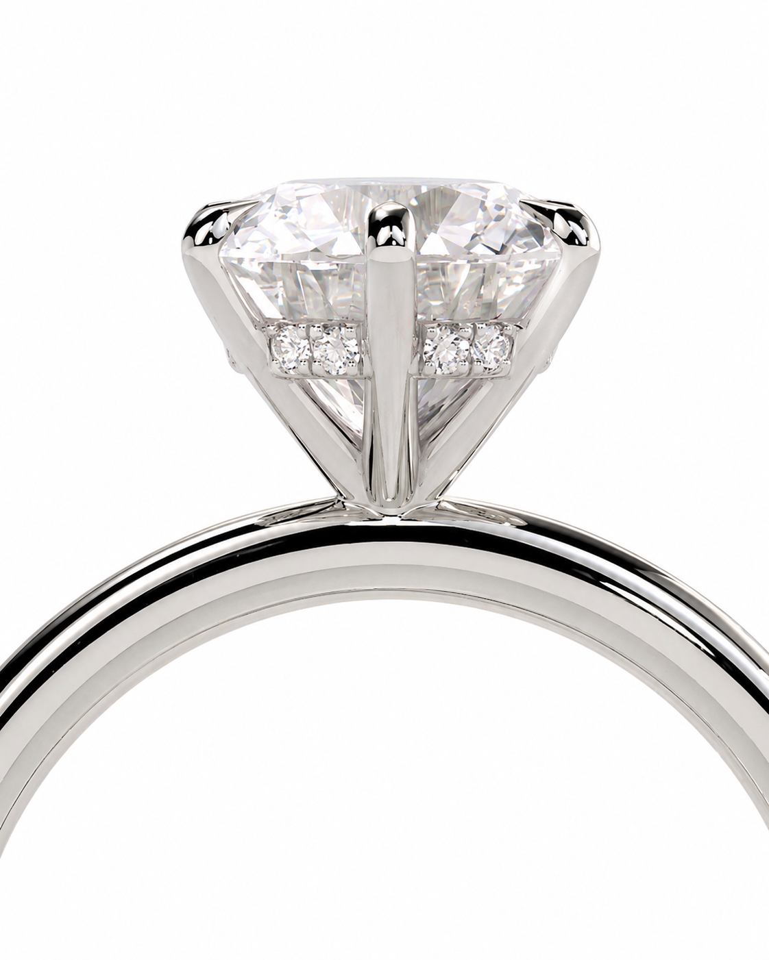 color_925_SIL,color_935_ARG,color_10K_WG, color_14K_WG &&A close-up studio shot of a silver-toned diamond ring featuring a large round-cut center stone and smaller diamonds along the band, set against a plain white background.