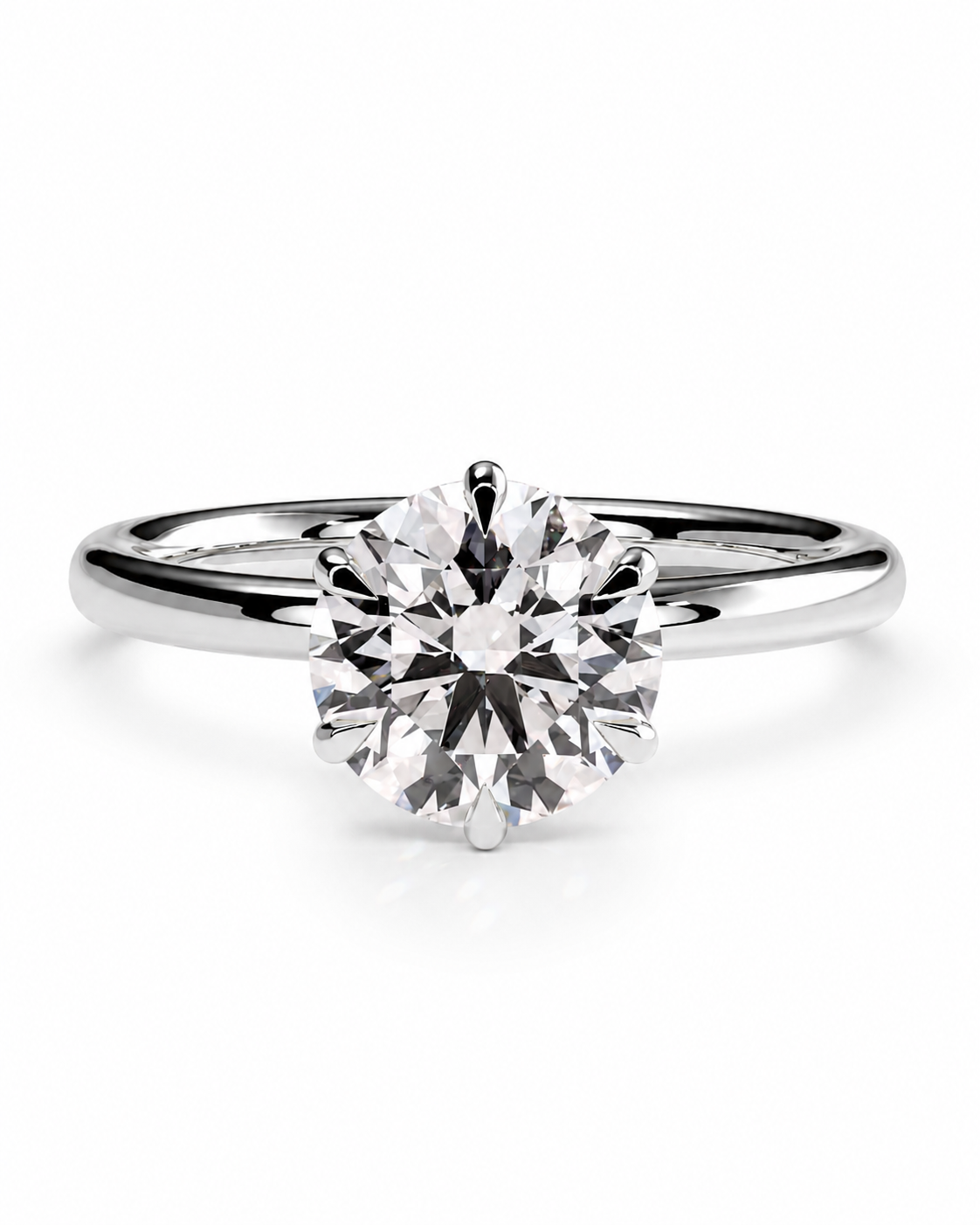 color_925_SIL,color_935_ARG,color_10K_WG, color_14K_WG &&A classic solitaire engagement ring featuring a round brilliant-cut diamond set in a polished white gold or platinum band, shown on a clean white background.