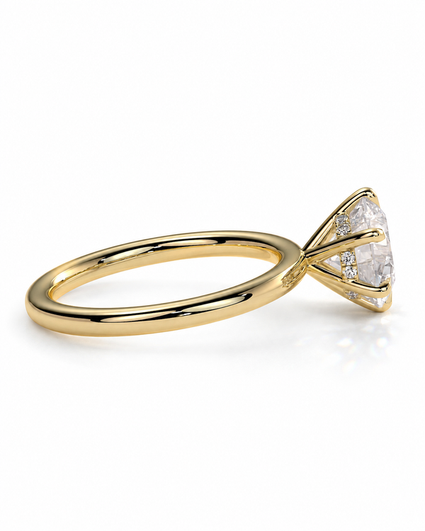 color_10K_YG, color_14K_YG &&A yellow gold solitaire engagement ring featuring a large cushion-cut diamond center stone with smaller accent diamonds along the shoulders, shown on a clean white background.
