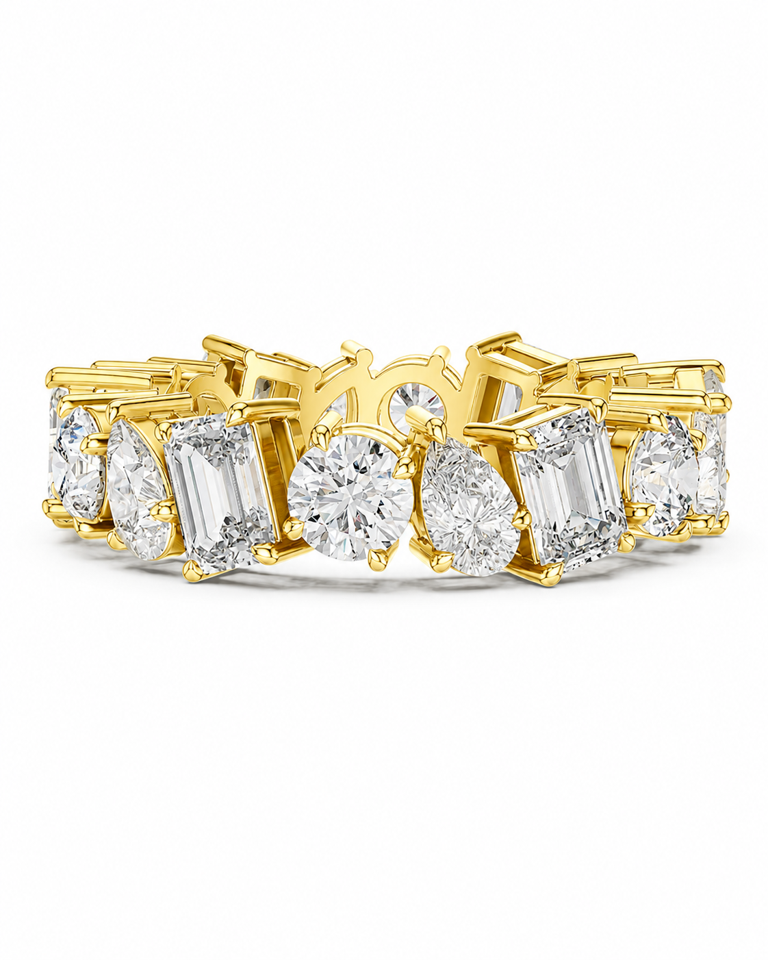color_10K_YG, color_14K_YG &&	
A yellow gold eternity band ring set with clear baguette, round, and pear-cut diamonds on a clean white background.