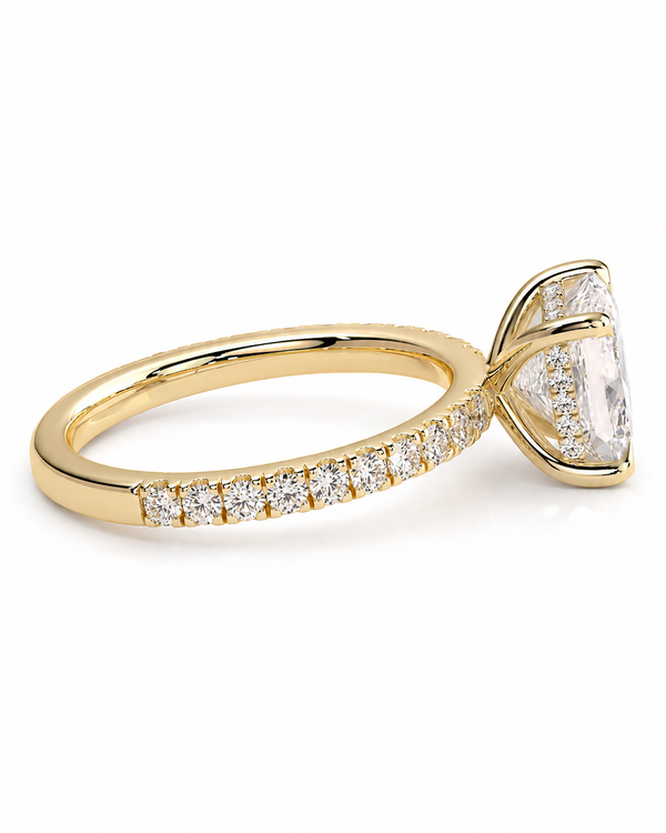 color_10K_YG, color_14K_YG &&A yellow gold ring featuring a large marquise-cut clear center stone and a pave band with small round stones, shown on a white background.