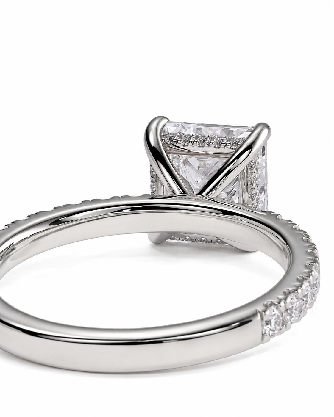 color_925_SIL,color_935_ARG,color_10K_WG, color_14K_WG &&A close-up shot of a silver-toned diamond ring featuring a square-cut center stone and pave-set diamonds along the band, set against a plain white background.