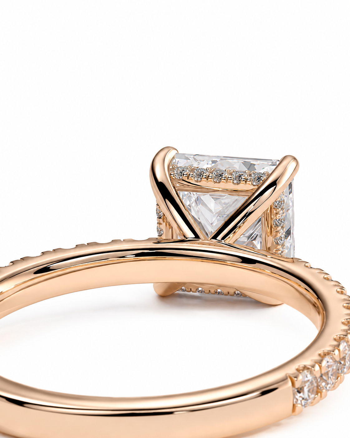 color_10K_RG, color_14K_RG &&Rose gold ring with a square clear gemstone in a prong setting, featuring pave accents and a row of small stones along the band, shown on a white background.