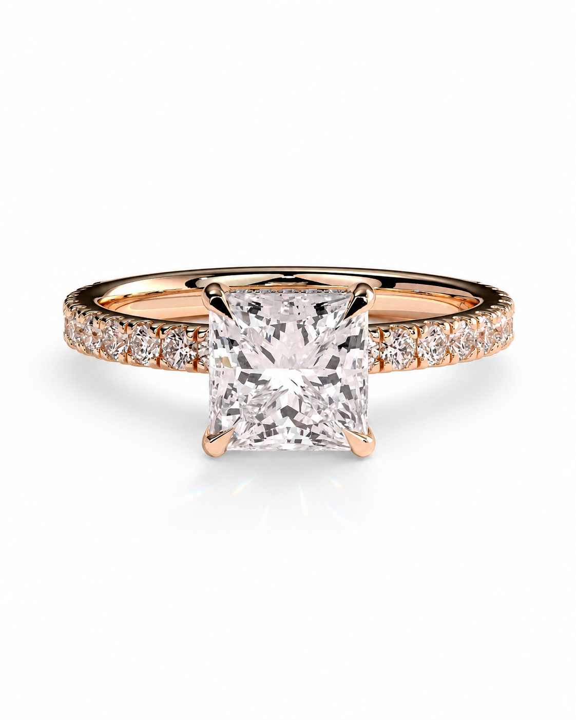 color_10K_RG, color_14K_RG &&A rose gold engagement ring featuring a large princess-cut diamond center stone and a pave band with small round diamonds, set against a clean white background.